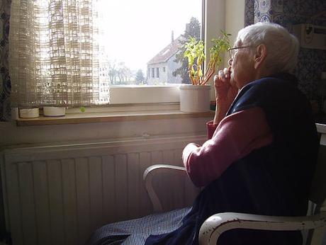 elderly looking out window