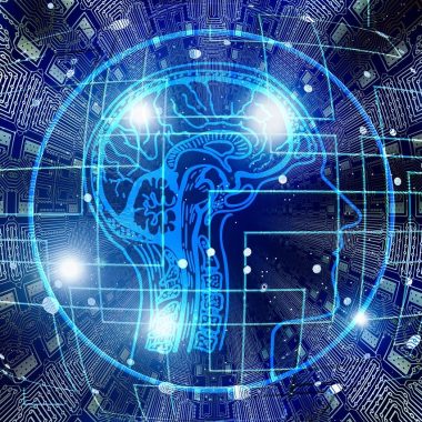 Un cerchio azzurro su sfondo blu, con dentro un cervello stilizzato azzurro, varie linee azzurre e luminose che simulano connessioni del computer