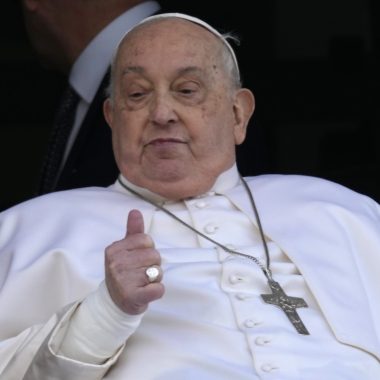 Pope Francis gives the thumbs up as he appears at a window of the Agostino Gemelli Polyclinic in Rome, Sunday, March 23, 2025
